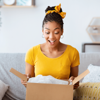 hpp_woman_opening_box_1568x1644_unsplash hpp_woman_opening_box_1568x1644_unsplash